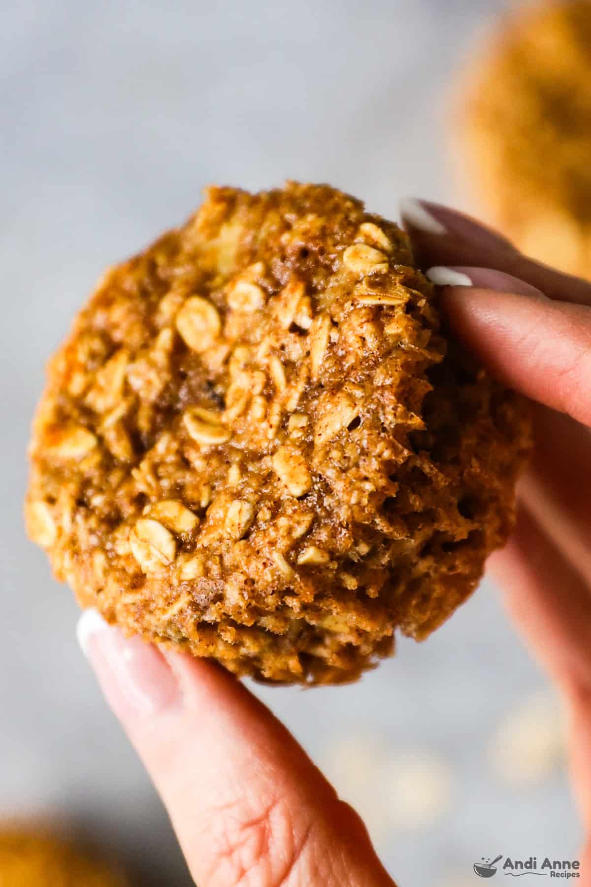 hand holding banana oat muffin