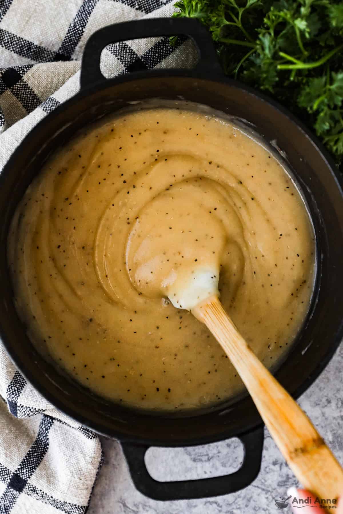 A pot of old-fashioned brown gravy.