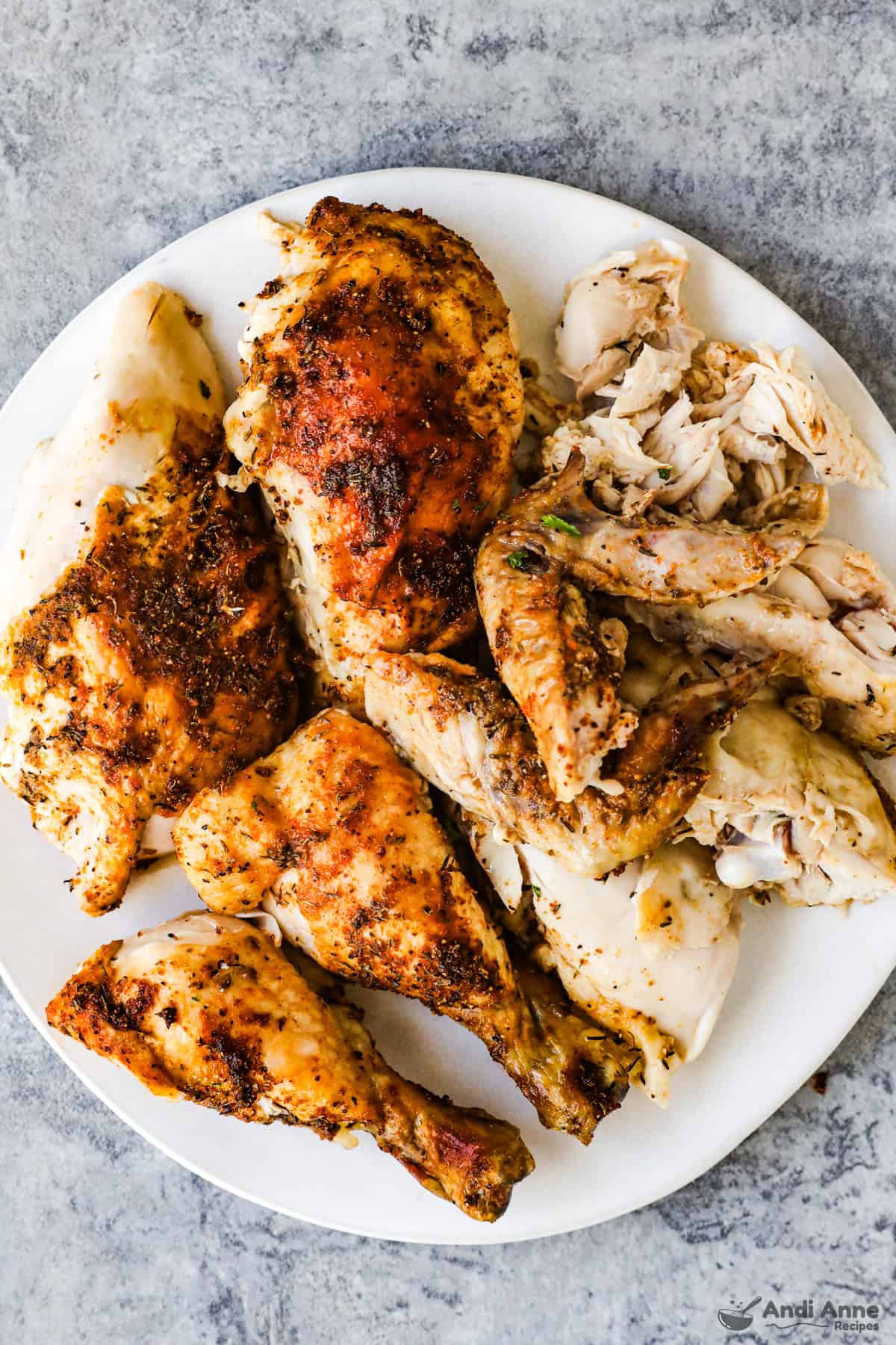 Carved chicken on a white plate.