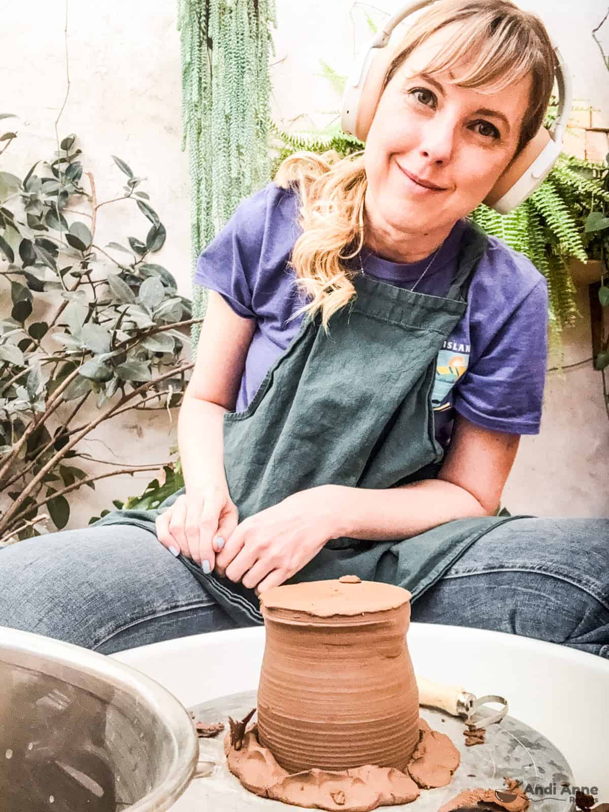 woman in front of pottery wheel